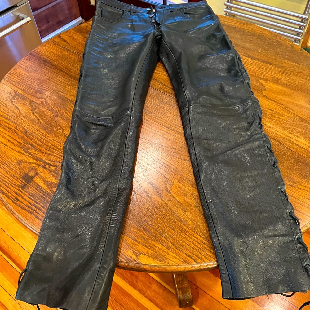 Black 33”waist 34”inseam button-fly leather pants by Sticks & Stones, Amsterdam.